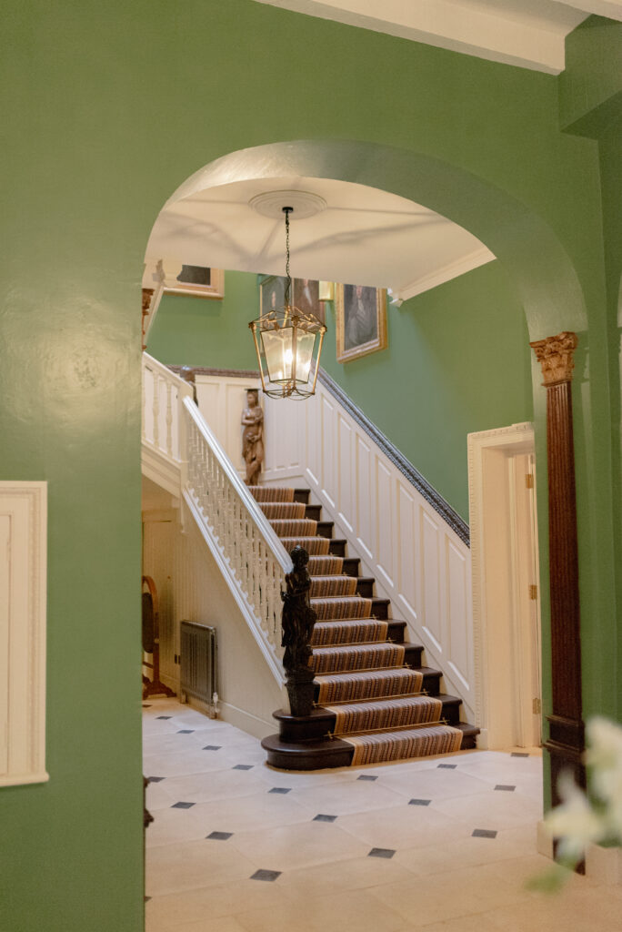 The interior hallway of Penicuik House, Penicuik Estate, Scotland — an exclusive use, private country estate wedding venue near Edinburgh, Scotland. Image by luxury fine art wedding photographer Scotland, Jill Cherry Porter, in connection with luxury wedding planner, Emma Matthews founder of Timeless White Wedding Planning, and Jill Alexander, luxury wedding florist UK, The Little Flower Atelier.