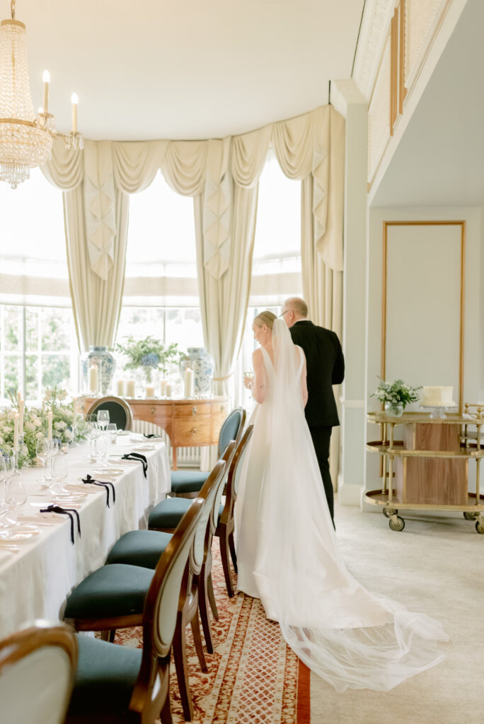Bride and Groom view their wedding reception design on their Gleneagles wedding day, Scotland. Image by award winning luxury wedding photographer, Jill Cherry Porter.