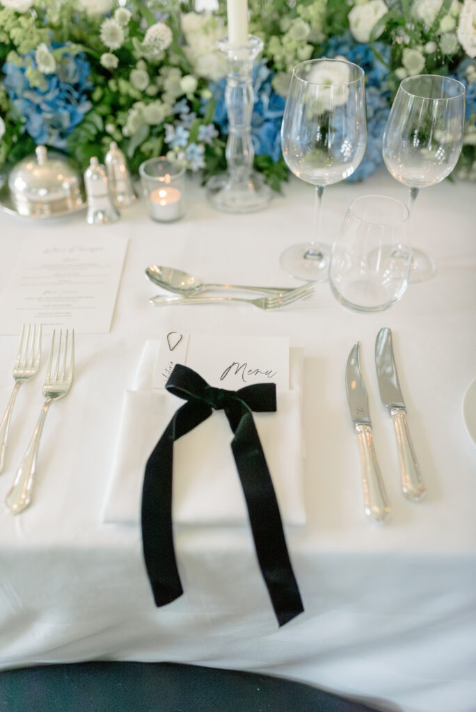 Black velvet bow wedding table setting detail in Gleneagles. Image by award winning luxury wedding photographer Scotland, Jill Cherry Porter.