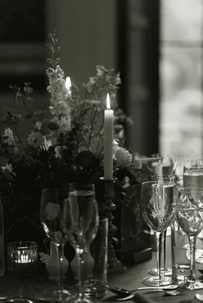 Black and white image of candlelit wedding table design by Scotland wedding planner Jamie Neil of NOVU weddings, at Drumtochty Castle. Image by award winning luxury wedding photographer in Scotland, Jill Cherry Porter.