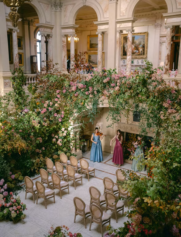 Abundant florals in the entrance hall of a Gosford House wedding in Scotland, planned by leading luxury wedding planner uk, Rosie Green Events.