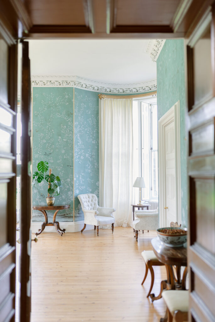 The drawing room painted walls of Birkhill Castle, an exclusive-use private estate wedding venue in Scotland