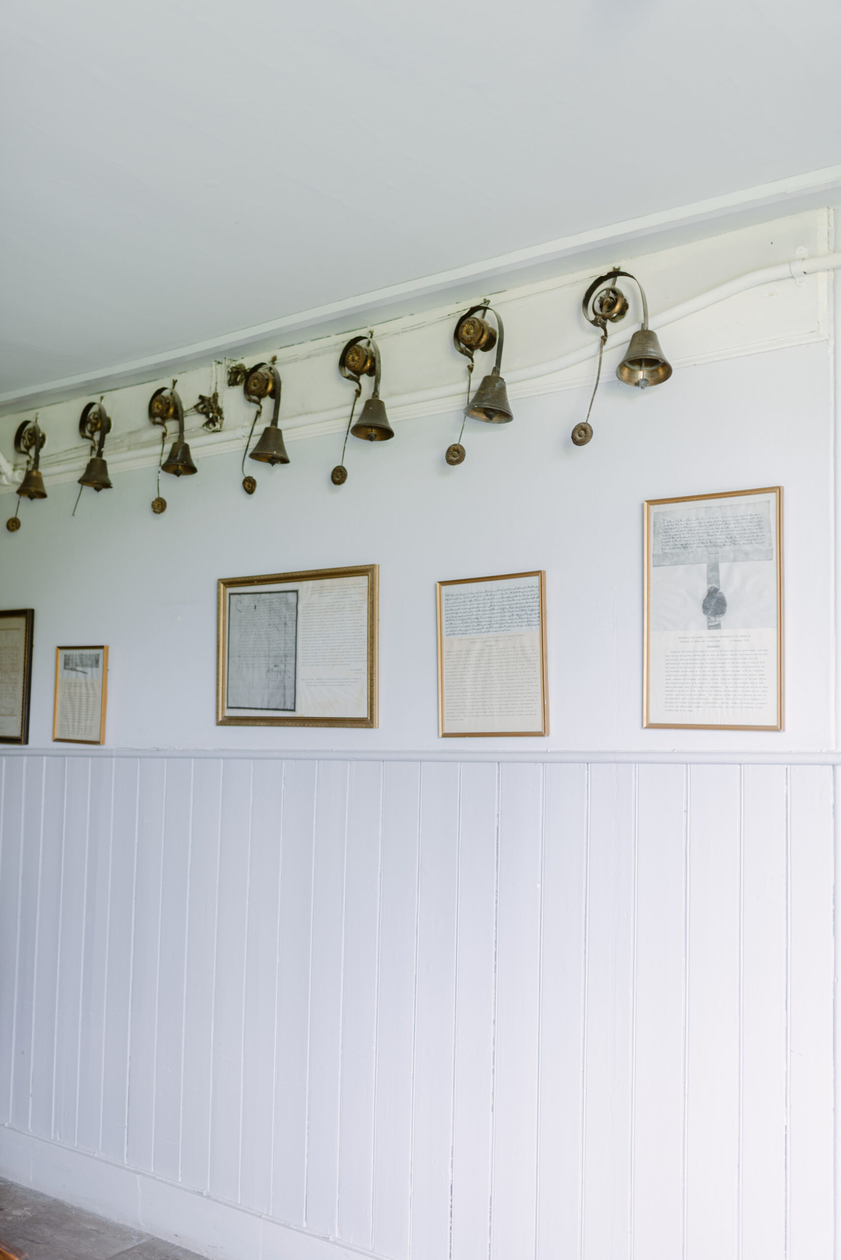 Original servants’ bells preserved along the corridor