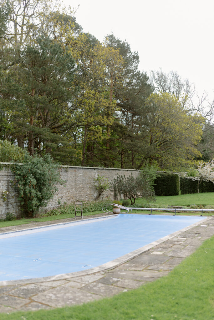 The outdoor swimming pool and facilities of Birkhill Castle, an exclusive-use private estate wedding venue in Scotland