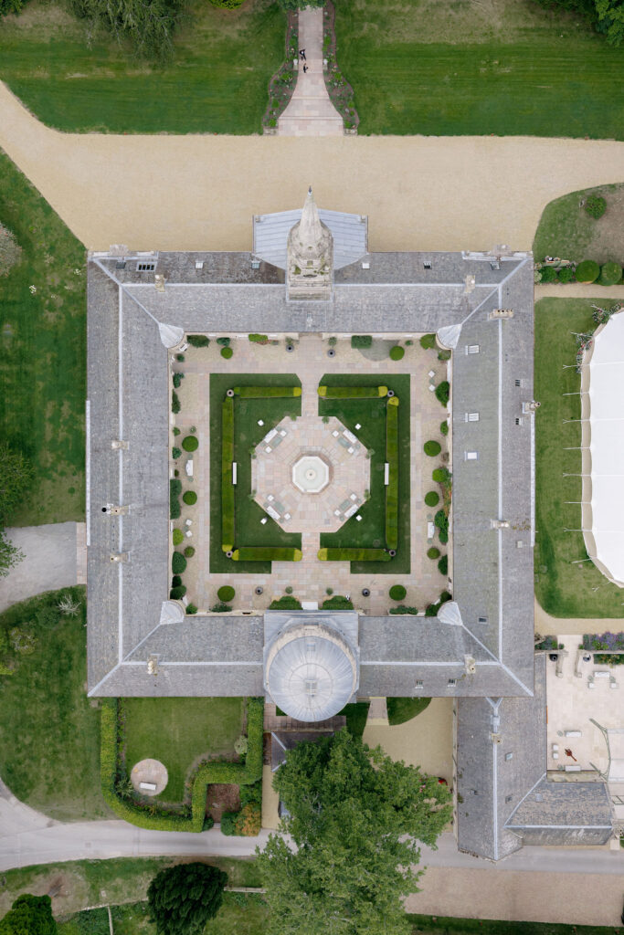 Penicuik House courtyard from above on a summer wedding day on Penicuik Estate, Scotland. Image by Penicuik House recommended photographer, Jill Cherry Porter.