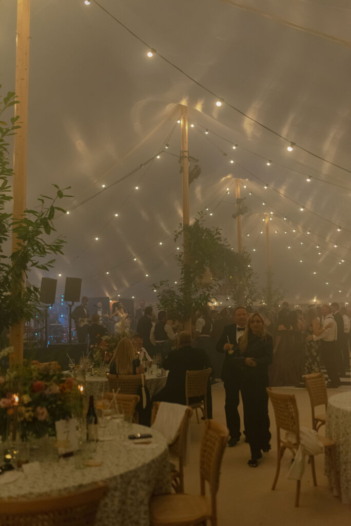 Atmospheric wedding photography in a sailcloth marquee on Penicuik Estate, Scotland destination wedding venue. Image by Penicuik House recommended wedding photographer, Jill Cherry Porter.