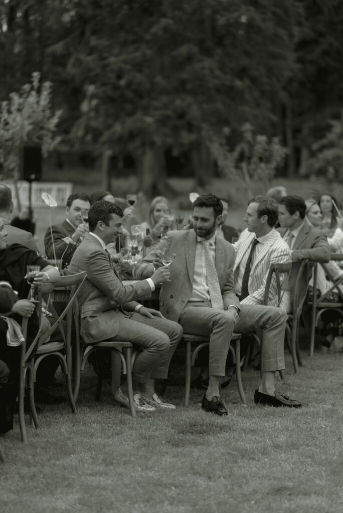 Couple toast speeches at Eskfield on Penicuik Estate, Scotland destination wedding venue. Image by Penicuik House recommended wedding photographer, Jill Cherry Porter.