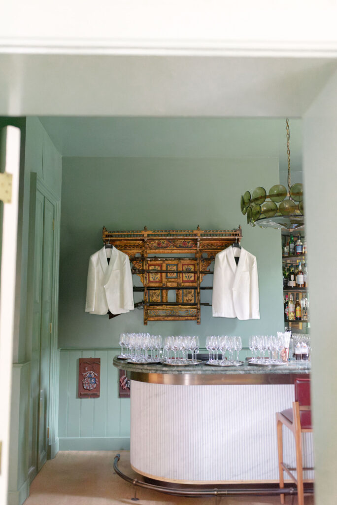 Groom tuxedo jackets hanging in bar within Penicuik House on Penicuik Estate, Scotland destination wedding venue. Image by Penicuik House recommended wedding photographer, Jill Cherry Porter.