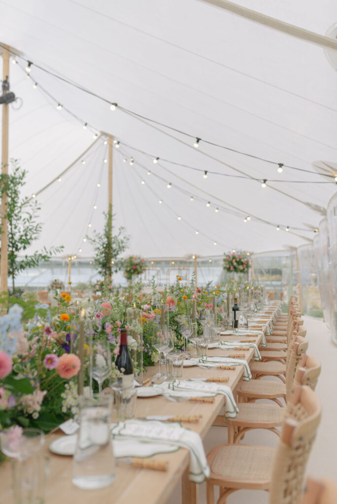 Sailcloth marquee wedding interior on Penicuik Estate, Scotland destination wedding venue. Image by Penicuik House recommended wedding photographer, Jill Cherry Porter.
